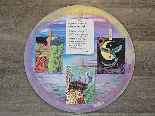 hand-painted circular frame with grasshopper yak quetzal and handwritten poem